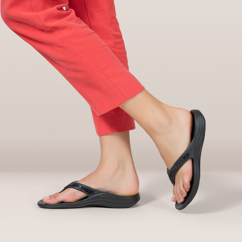 black sparkle orthotic flip flops on feet 